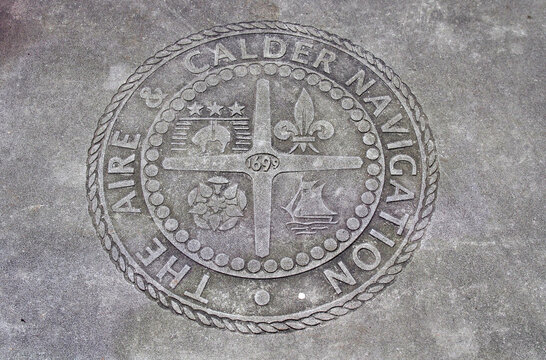 leeds, west yorkshire, united kingdom - 7 july 2021: commemorative plague for the aire and calder navigation company on leeds dock