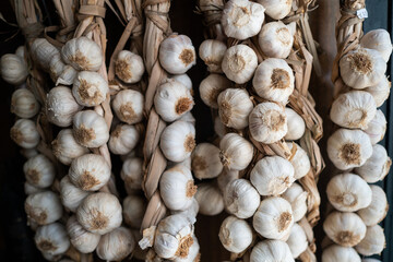 garlic drying outside as traditional at rural market