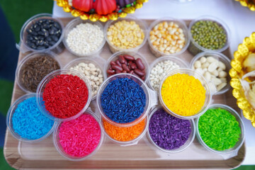 Top view Dyed rice, various colors and various grains Worship of the gods in hinduism
