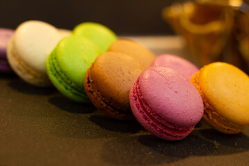 colorful macaroons on a wooden table