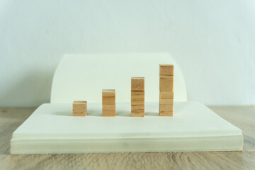 wood square block means trend of business graph grown up