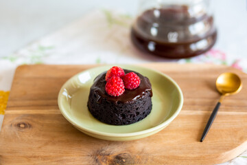 chocolate fondant cake. Mini cake for fondant with icing. Delicious  dessert.Homemade chocolate lava cake.Fondant Lava Cupcake.Warm chocolate dessert.Chocolate cake.Cupcake with berries.Breakfast 