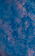 Banner beautiful thick blue clouds with pink veins. Mystical sky.