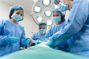 Medical Team Performing Surgical Operation in hospital operating. Medical team doing critical operation.
