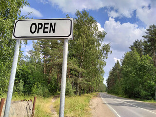 Open - on a sign before entering another country. The concept of opening borders after the pandemic for business and travel