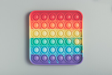 Rainbow toy antistress Pop It for the development of fine motor skills