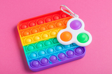 Rainbow antistress toys Pop It and Simple Dimple for the development of fine motor skills