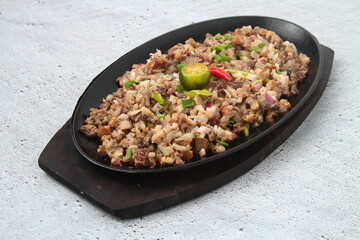 Freshly cooked Filipino food called pork sisig