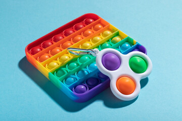 Fototapeta premium Rainbow antistress toys Pop It and Simple Dimple for the development of fine motor skills