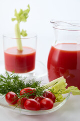 Tomato juice with pulp and cherry tomatoes with herbs