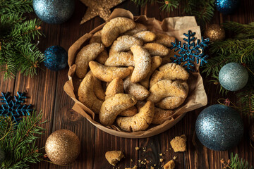 Homemade Christmas nuts cookies vanilla crescent with sugar powder in Christmas decorations. New...