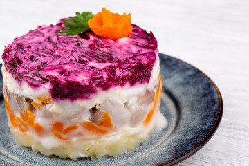 herring under fur coat, with potatoes, carrots, egg, mayonnaise, greens, beets