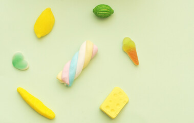 Delicious colorful jelly candy on background
