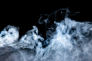 gray smoke with a blue tint on a black background