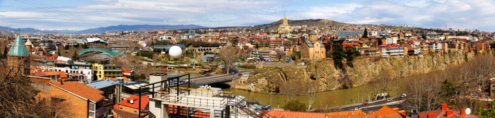 Beautiful view of Kura river and Bridge of Peace in Tbilisi, Georgia © JackF