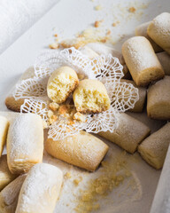 Sweet sugar powdered homemade cookies on white background, selective focus