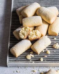 Sweet sugar powdered homemade cookies on grey background, selective focus