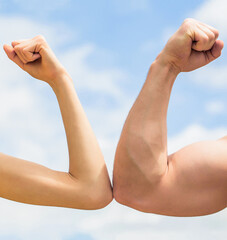 Vs, fight hard. Competition, strength comparison. Rivalry concept. Hand, man arm fist Close-up. Rivalry, vs, challenge, strength comparison. Sporty man and woman. Muscular arm vs weak hand