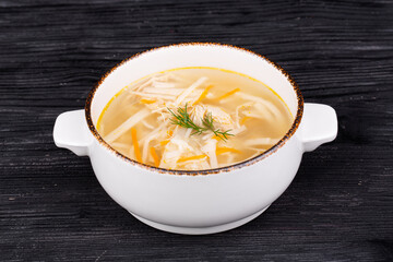 chicken noodle soup, onion, carrots, greens