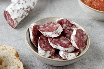 Sliced fuet typical Catalan sausage. Thin dried sausage.
