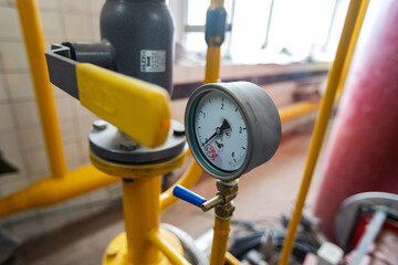 the gas pipeline at the plant. yellow pipeline for the transportation of energy raw materials under...