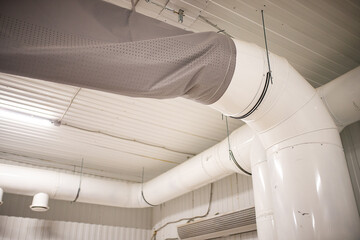ventilation pipes in the warehouse. communications for the circulation of fresh air in industrial...