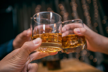 Celebrate whiskey on a friendly party in  restaurant.