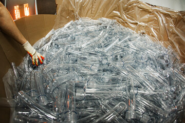 a bag of empty plastic bottles collected for recycling. the use of plastic as a secondary raw material. caring for the environment and the environment. plastic waste is ready for recycling