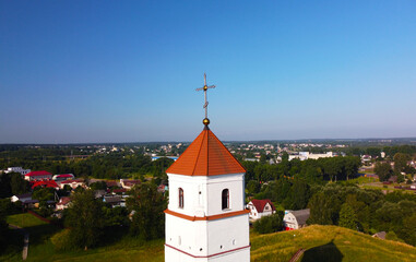 Aerial view of the cross on the tower. Medieval European church with Romanesque architecture