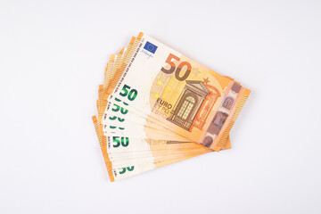 Closeup of a pile of fifty euros isolated on a white background