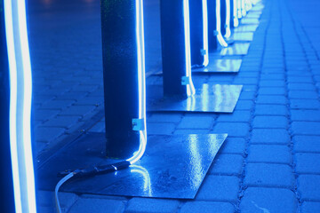 Blue led neon strip light glowing in dark light.