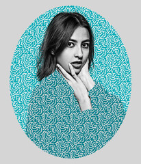 Portrait of one young caucasian woman in blue green patterned clothes, the same as background of...