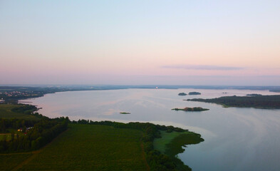 Aerial view of blue lake water landscape at sunrise