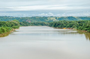 Picturesque view of Phalguni River with hills and fields in the background at Polali, Mangalore, Karnataka, India