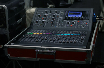 Stage lighting mixer console controller in dark light.