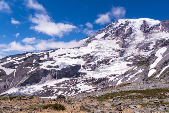 Mount Rainier With A Blue Sky And A Few Clouds During Summer