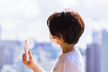 Japanese woman has a handy fan in summer