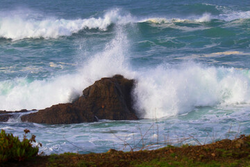 waves crashing on rocks