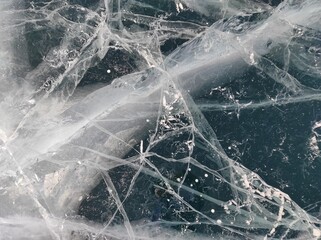 transparent ice with bubbles and cracks
