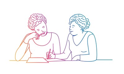 Two female students doing homework together.