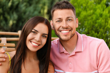 Obraz premium Portrait of happy couple resting together outdoors