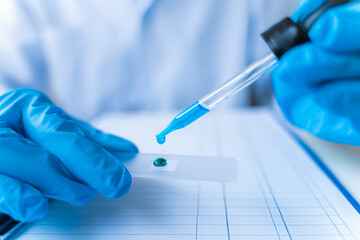 Science experiment. Health care researchers working in life science laboratory