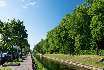 Center of Europe city with road near river and park