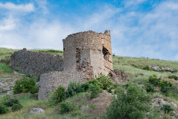 Fototapeta na wymiar View tower of Chembalo fortress. Medieval architecture monument, landmark. Ruined stone Genoese fortress in Balaklava in Crimea 