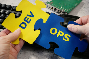keyboard sticker DevOps. DevOps Concept for software engineering culture and practice of software...