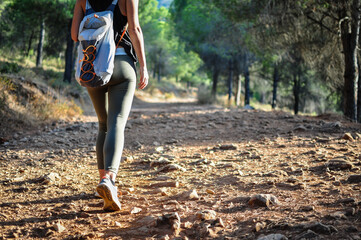 Young woman walking along a path in the country, close up view
