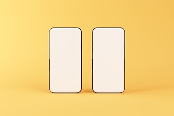 Pair of smartphones with blank screen isolated on yellow. Mockup to showcasing mobile web-site design or screenshots your applications. 3D illustration.