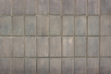 Gray-brown tile background. Beautiful shabby tiles. Pretty texture