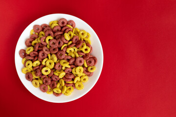 cereal cheerios bowl isolated on red background