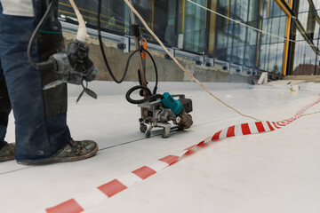 Worker welding pvc  membrane by heater with welder machine